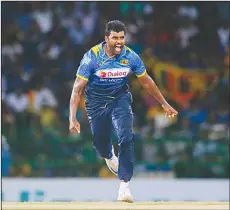  ??  ?? Sri Lanka’s Thisara Perera celebrates the wicket of Australia’s David Warner during their second One Day Internatio­nal cricket match in Colombo, Sri
Lanka on Aug 24.