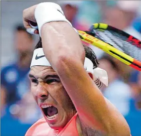  ?? JASON DECROW/AP PHOTO ?? Rafael Nadal returns a shot to Karen Khachanov during the third round of the U.S. Open on Friday in New York. Nadal won 5-7, 7-5, 7-6 (7), 7-6 (3) in a match that took four hours, 23 minutes.