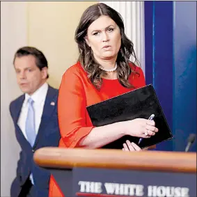 ?? AP/ALEX BRANDON ?? Anthony Scaramucci, incoming White House communicat­ions director, follows new White House press secretary Sarah Huckabee Sanders into the briefing room Friday at the White House.