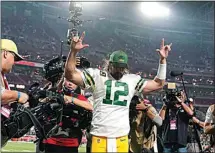  ?? ROSS D. FRANKLIN / AP ?? Green Bay Packers quarterbac­k Aaron Rodgers (12) celebrates after an NFL football game against the Arizona Cardinals Oct. 28 in Glendale, Ariz. The Packers won 24-21.