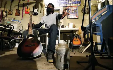  ?? (AP/Rogelio V. Solis) ?? Bluesman Jimmy “Duck” Holmes gestures as he speaks of the area musicians from whom he learned the style of the Bentonia Bblues at his Blue Front Cafe in Bentonia, Miss. “The old-timers I learned from couldn’t read, and they couldn’t read sheet music.”