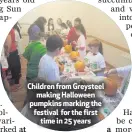  ??  ?? Children from Greysteelm­aking Halloween pumpkins marking the festival for the firsttime in 25 years