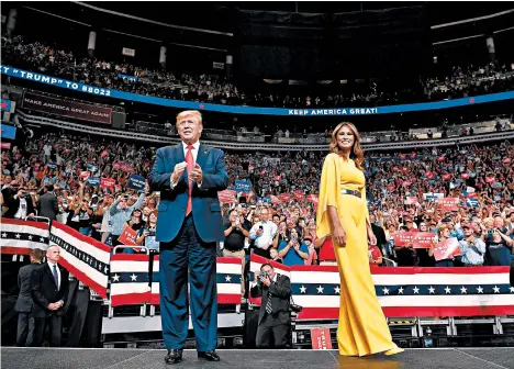  ?? MANDEL NGAN/GETTY-AFP ?? President Donald Trump and first lady Melania Trump arrive Tuesday for the launch of his 2020 campaign in Orlando, Florida.