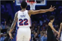  ?? CHRIS SZAGOLA — THE ASSOCIATED PRESS ?? Sixers guard Cameron Payne makes sure his long-distance basket counts in full during Sunday’s game against the Nets.