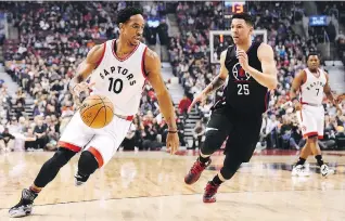  ?? FRANK GUNN/THE CANADIAN PRESS ?? Toronto guard DeMar DeRozan, left, is confident in the team’s current roster heading down the stretch run of the NBA season, despite a feeling the Raptors need to add defensive help.