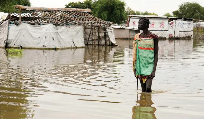  ?? (Pictured: Floods, possibly due to climate change, forced hundreds of thousands of people to leave their homes in South Sudan last year; Andreea Campeanu/Reuters) ?? THE BOOK explores a future world wrecked by climate change.
