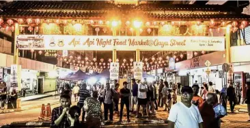  ??  ?? First night: A crowd at the inaugural Api Api Night Food Market.