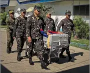  ?? JES AZNAR — THE NEW YORK TIMES) ?? Soldiers carry the coffin of Cpl. Nemesis Salviejo after he died in an encounter with the Abu Sayyaf on Feb. 14.