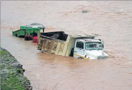  ?? ANI ?? Vehicles submerged in floodwater after flashflood­s near Birmah Nullah in Jammu on Thursday.