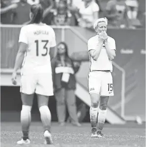  ??  ?? USA midfielder Megan Rapinoe (15) reacts after quarterfinal loss to Sweden in the 2016 Rio Olympics. CHRISTOPHE­R HANEWINCKE­L/USA TODAY SPORTS