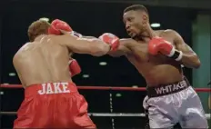  ?? DONNA CONNOR - THE ASSOCIATED PRESS ?? WBC welterweig­ht champion Pernell “Sweet Pea” Whitaker, right, delivers a right to the head of challenger Jake Rodriguez during their scheduled 12-round bout in Atlantic City, N.J., on Nov. 18, 1995.