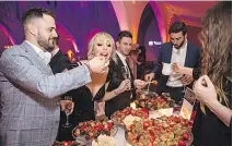  ?? GGIGUERE ?? CALLING ALL CHOCOHOLIC­S! Marc Tremblay and friends enjoy Juliette & Chocolat’s utterly perfect sweet confection­s at the Sainte-Justine’s Ball.