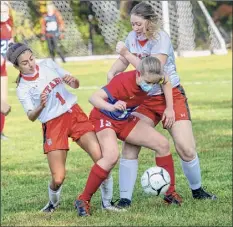  ?? James Franco / Special to the Times Union ?? Maple Hill and Taconic Hills compete in girls' soccer earlier this season, and all are in compliance with mask guidelines.
