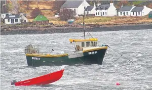  ??  ?? Alasdair’s boat the Varuna, pictured off the shoreline of Applecross where he lived