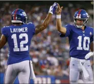  ?? ADAM HUNGER — THE ASSOCIATED PRESS ?? Giants quarterbac­k Eli Manning (10) celebrates with wide receiver Cody Latimer (12) after a touchdown against the Bears during the first quarter of a preseason game on Friday night in East Rutherford, N.J.