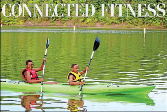  ?? MICHILEA PATTERSON — DIGITAL FIRST MEDIA ?? Two youth part of a Rails-to-Trails Conservanc­y Sojourn kayak at Green Lane Park in Montgomery County. The group is bicycling 150 miles round trip as part of the sojourn as well.