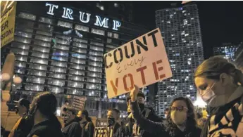  ?? ASHLEE REZIN GARCIA/ SUN- TIMES ?? At least 1,000 demonstrat­ors on Wednesday marched through the Loop.