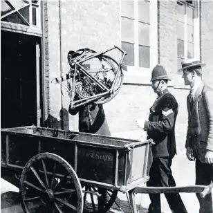  ??  ?? EVIDENCE: The bicycle being unloaded from a police cart and carried into court