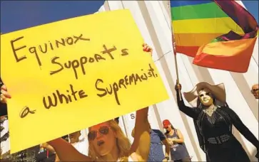  ?? Genaro Molina Los Angeles Times ?? TAMI SMITH, left, and Sister Bearonce Knows, with the Sisters of Perpetual Indulgence, join a rally near the Equinox fitness club to protest billionair­e Stephen Ross, who held a reelection event for President Trump.