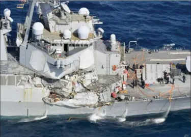  ?? IORI SAGISAWA — KYODO NEWS VIA AP ?? The damage of the right side of the USS Fitzgerald is seen off Shimoda, Shizuoka prefecture, Japan, after the Navy destroyer collided with a merchant ship, Saturday. The U.S. Navy says the USS Fitzgerald suffered damage below the water line on its...