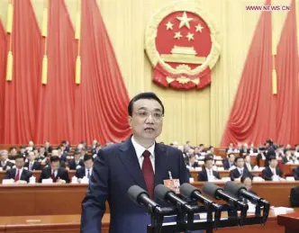  ?? XINHUA/JU PENG ?? Chinese Premier Li Keqiang delivers a government work report at the opening meeting of the first session of the 13th National People’s Congress at the Great Hall of the People in Beijing, capital of China, March 5.