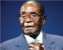  ??  ?? Zimbabwean President Robert Mugabe leaves the stage after participat­ing in a discussion at the World Economic Forum meeting in Durban, South Africa on May 4. (Reuters)