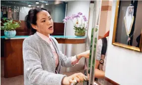  ?? Photo: Sam Tsang ?? A portrait of the prince hangs on a wall next to the reception at the Shun Tak Centre office.