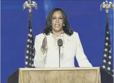  ??  ?? 0 Vice President-elect Kamala Harris receives applause