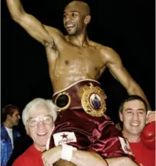  ?? Photo: ACTION IMAGES ?? BRILLIANT TRAINER, GONE BUT NEVER FORGOTTEN: Freddie King [left] holds aloft one of his world champions, Paul Jones