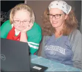  ?? SUSAN DEGRANE/DAILY SOUTHTOWN ?? Lisa Mulcrone, right, and her sister, Sioban Clancy, visit with Special Olympic Chicago athletes and their families via Zoom following a recent online cooking lesson.