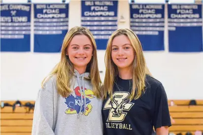  ?? Photos by Dave Stewart/Hearst Connecticu­t Media ?? Darien’s twin sisters Ellie (left) and Aubrey Moore will be taking their volleyball talents to the Div, I college level next year when Ellie joins Kansas and Aubrey joins Boston College.