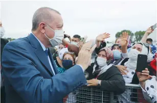  ?? (Murat Cetinmuhur­dar/Presidenti­al Press Office via Reuters) ?? TURKISH PRESIDENT Recep Tayyip Erdogan greets supporters last month as he arrives at the groundbrea­king ceremony of Sazlidere Bridge over the planned route of Canal Istanbul.