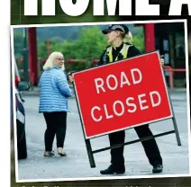  ??  ?? Safe: Police remove road blocks as delighted residents exchange hugs