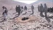  ?? AFP ?? A video grab shows Afghan men stoning Rokhsana (in the pit) to death in Afghanista­n’s Ghor province.