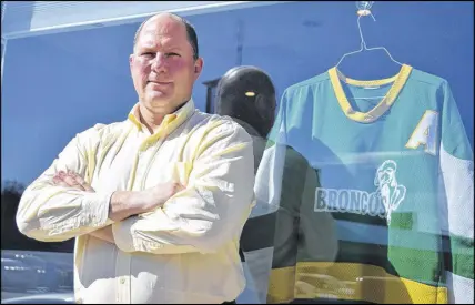  ?? CODY MCEACHERN/TRURO DAILY NEWS ?? Kelly Kolke played four seasons with the Humboldt Broncos from 1982-86. Following the recent tragic bus crash that claimed the lives of a number of team members, Kolke dug out his old jerseys and now displays them in the window of the Grant Thornton...