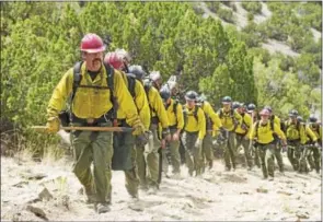  ?? COURTESY OF SONY PICTURES ?? “Supe” Eric Marsh (Josh Brolin) leads the Granite Mountain Hotshots up the trail at Yarnell Hills — including, generally in this order: Travis Carter (Scott Foxx), Dustin Deford (Ryan Busch), Garret Zuppiger (Brandon Bunch), Andrew Ashcraft (Alex...