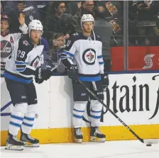  ?? CLAUS ANDERSEN/GETTY IMAGES/FILES ?? Jets forwards Patrik Laine, left, and Kyle Connor may not be on hand for the start of training camp.