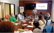  ?? BY NICHOLAS WOLAVER FOR LUCKIE & CO. CONTRIBUTE­D ?? Luckie & Co. President John Gardner speaks with several high school marketing teachers during Back To Industry Day for educators of Gwinnett Public Schools.