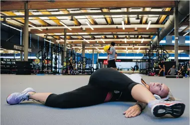  ??  ?? Bobsled driver Kaillie Humphries works out at the Winter Sport Institute in Calgary. The training centre is named the Markin- MacPhail Centre after benefactor­s Allan Markin and Keith MacPhail.