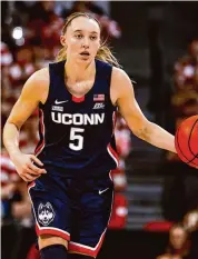  ?? Lance King/Getty Images ?? UConn's Paige Bueckers, seen her during a November game against NC State, finished with 17 points in the Huskies' win over Providence on Saturday.