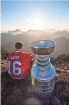  ?? MARK L. JOHNSON/AP ?? Andrew Ladd spent his day with the Stanley Cup atop Crown Mountain, British Columbia, in 2010.