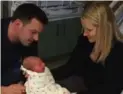  ??  ?? Joe and Heidi Rand with seven-pound, eight-ounce Mila.