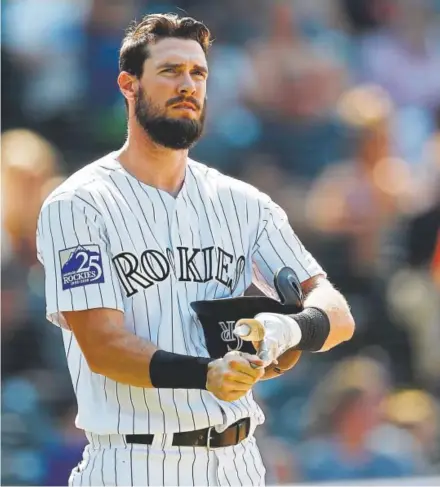  ??  ?? Colorado’s David Dahl laments after striking out to end the seventh inning Wednesday.