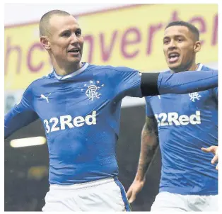  ??  ?? UP FIR IT Miller celebrates his goal at Fir Park yesterday with Tavernier (right)