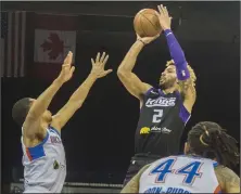  ?? CLIFFORD OTO/STOCKTON RECORD ?? The Kings' Cody Demps, right, shoots over Oklahoma City's Abdul Gaddy on March 11 at the Stockton Arena. It was the final game Stockton played before the season was suspended due to the coronaviru­s pandemic.