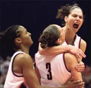  ?? Associated Press file photo ?? UConn’s Asjha Jones, left, Diana Taurasi (3) and Sue Bird celebrate late in the second half against then No. 2 Oklahoma in the 2002 national championsh­ip game.