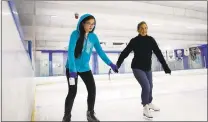  ?? JOSIE LEPE — STAFF PHOTOGRAPH­ER ?? Camille Iswandhi, 13, skates with mom Betsy Iswandhi, of Sunnyvale, during the public open skate session to all levels at Ice Center Cupertino in Cupertino on Thursday.