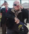  ??  ?? Above, Marine Corps vet Bill Robinson of Preston becomes emotional during taps at the Pearl Harbor ceremony at Norwich City Hall. Robinson and Army Air Forces veteran Paul Boyer, left, of Norwich were the only WWII veterans in attendance.