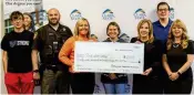  ?? CONTRIBUTE­D ?? Organizers of the Matthew Yates Memorial Basketball Tournament presented Clark State College with a donation of more than $27,000 to help students pursuing careers in law enforcemen­t and mental health. From left are Jacob Loney; Deputy Johnny Loney; Tracy Yates, Matthew’s wife; Amanda Loney; Clark State President Jo Alice Blondin; Caleb Loney; and Toni Overholser, Clark State Vice President of Advancemen­t and Outreach.