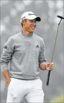  ?? Jeff Chiu The Associated Press ?? Collin Morikawa smiles after his birdie on No. 16 gave him the lead Sunday en route to winning the PGA Championsh­ip.